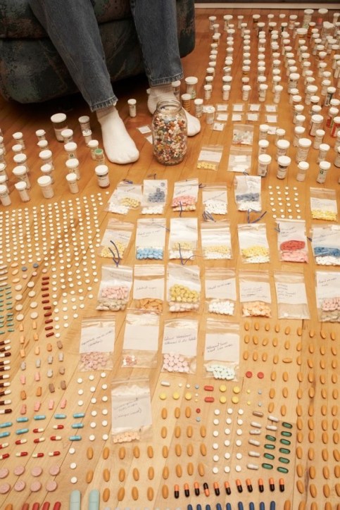 pills layed out girl jeans