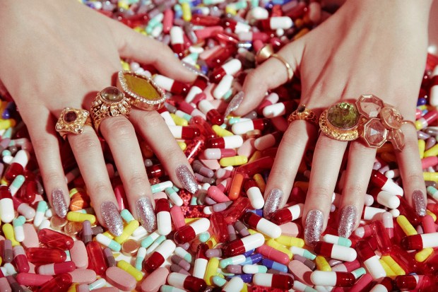 hands-in-tons-of-prescription-drugs-pills