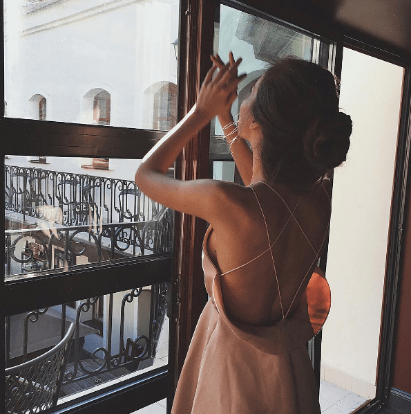 girl going out looking out window.png